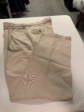 44X32 Timber Creek men's tan pleated khakis.  No Iron